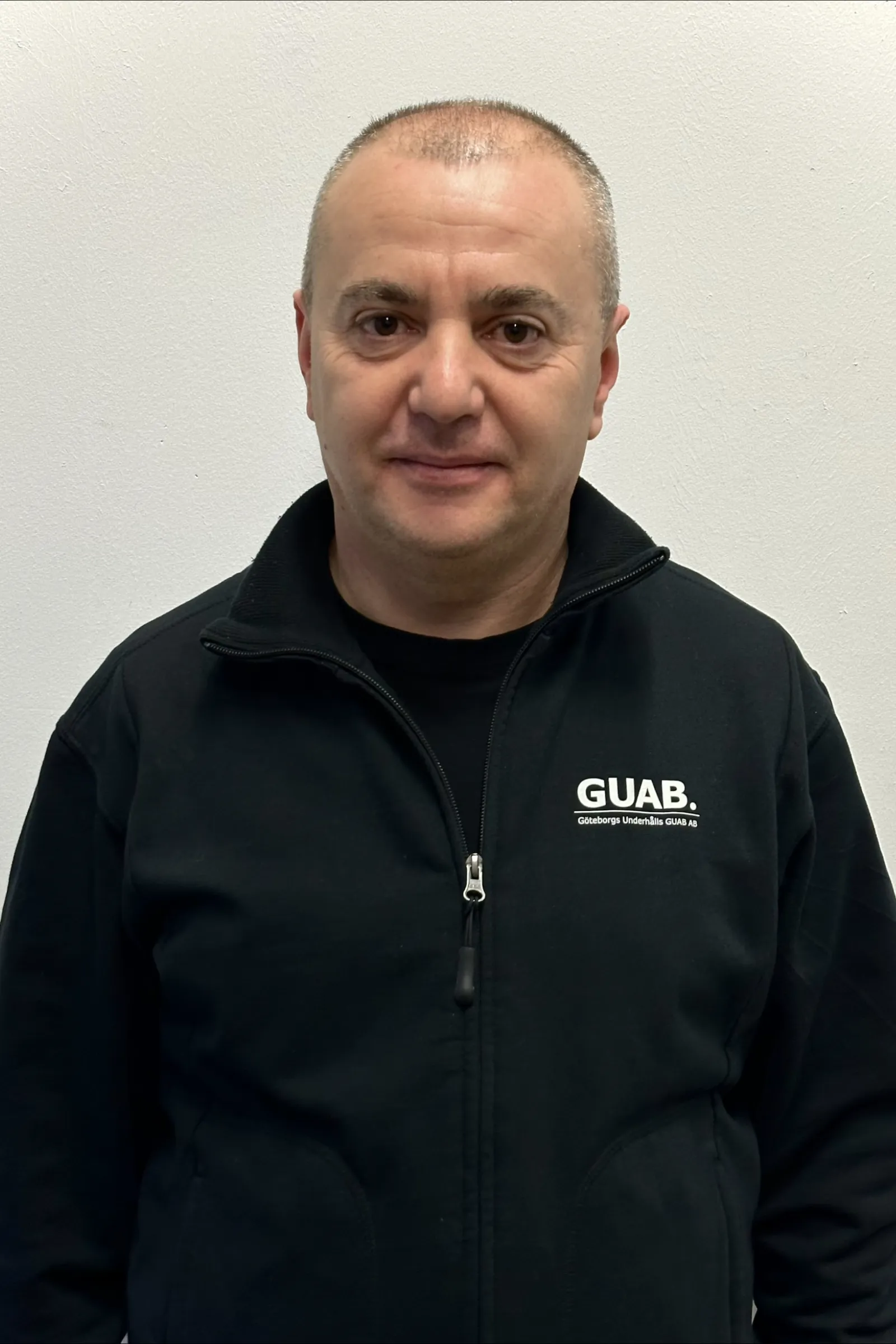 Medarbetare på Guab i arbetskläder